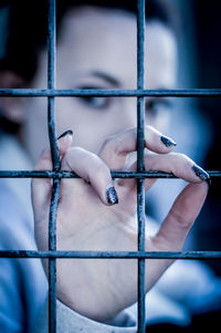 Close-up of woman holding metal