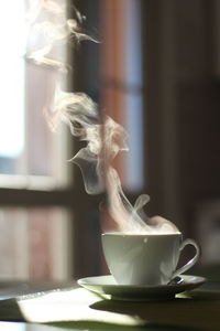 Close-up of coffee cup on table