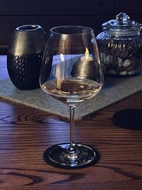 Close-up of wine glasses on table