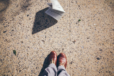 Low section of person standing on ground