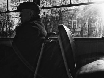 Rear view of man on window