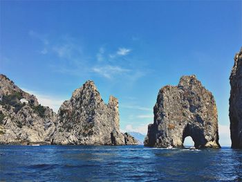 Scenic view of sea against blue sky