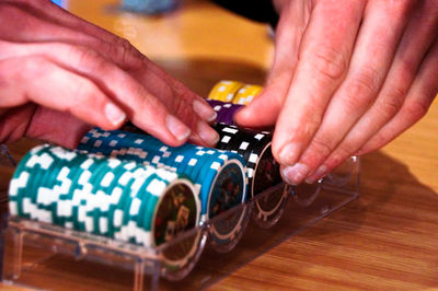 Close-up of man playing guitar on table