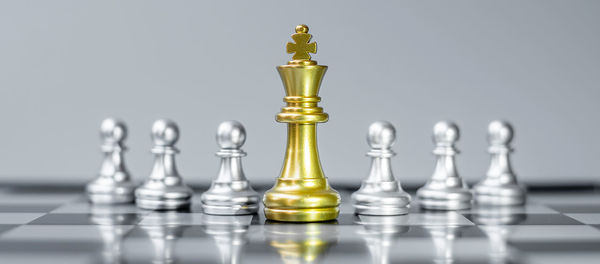Close-up of chess pieces on table