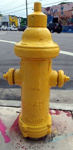 Close-up of fire hydrant on sidewalk