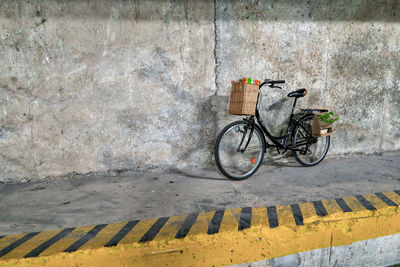 Bicycle parked on wall