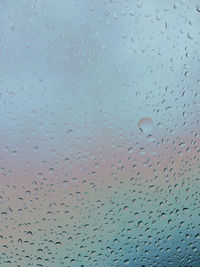 Full frame shot of wet glass window