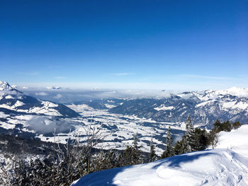 View from the unterberghorn mountain in tyrol austria over the snowy valleys in winter