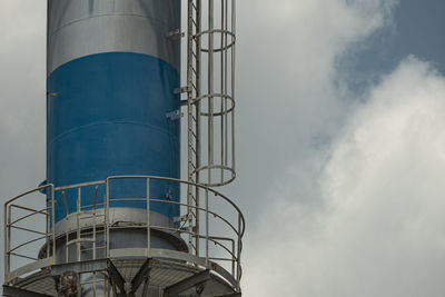 Low angle view of factory against sky