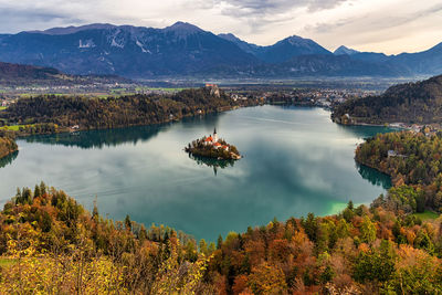 Scenic view of lake and mountains against sky