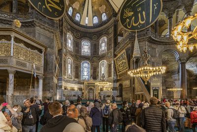 Istanbul, turkey - april 29, 2022 - tourists and pilgrims in the hagia sophia mosque