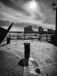 Observation point by lake against sky in city