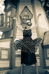 Young woman in front of building