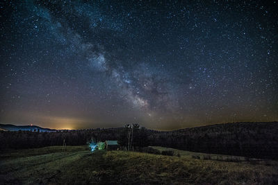 Scenic view of star field against sky at night