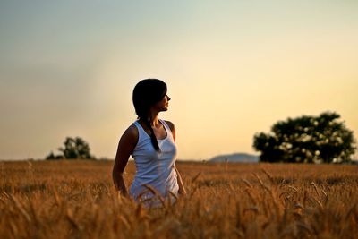 Woman standing on field