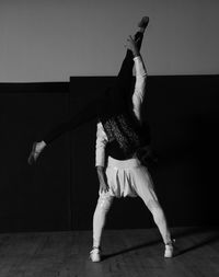 Full length of man skateboarding on wall