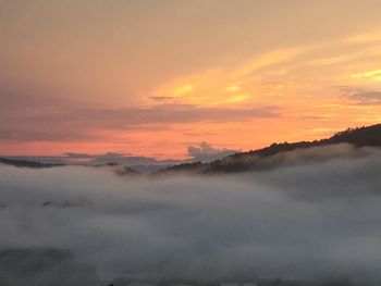 Scenic view of mountains against sky during sunset