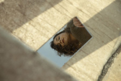 High angle view of woman lying on swimming pool
