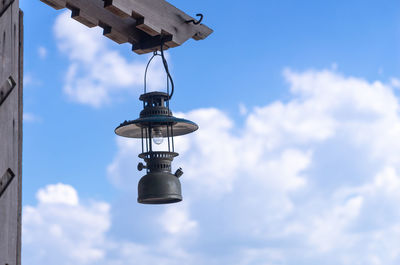 Low angle view of street light against sky