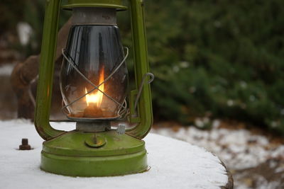 Close-up of illuminated lamp against black background