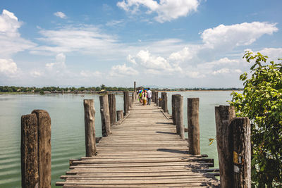 Rear view of man on wooden pier