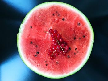 Close-up of delicious half a watermelon with red currant