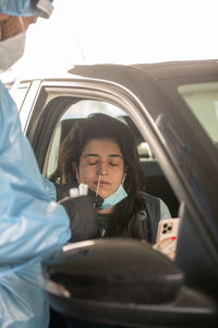 Woman sitting in car