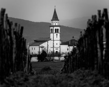 Church amidst buildings against sky