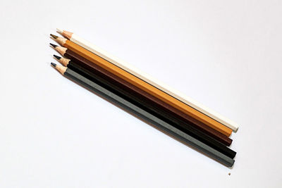 High angle view of pencils against white background