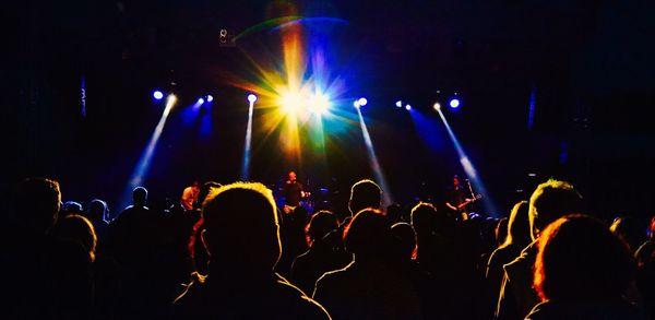 People enjoying music concert