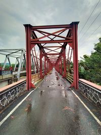 Footbridge over bridge against sky