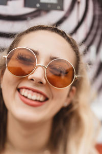 Close-up portrait of a smiling young woman