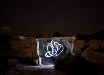 Graffiti on wall at night