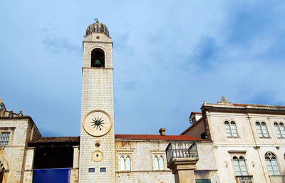 Low angle view of bell tower against sky