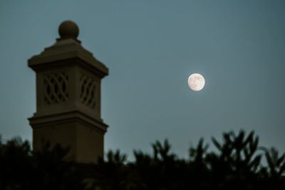 Low angle view of silhouette tower against sky at night