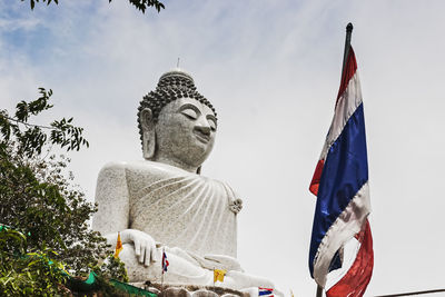 Low angle view of statue against sky