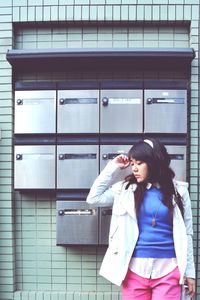 Young woman photographing through smart phone