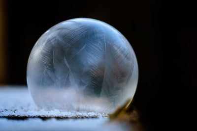 Close-up of ice over black background