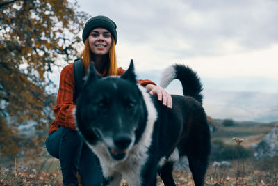 Young woman with a horse