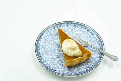 High angle view of food in plate on white background