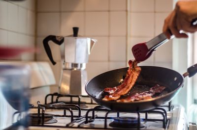 Close-up of person preparing food in kitchen