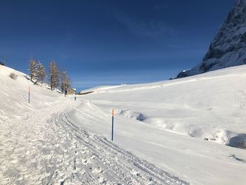 Scenic view of snow covered mountains against sky