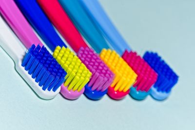 Close-up of brushes over blue background
