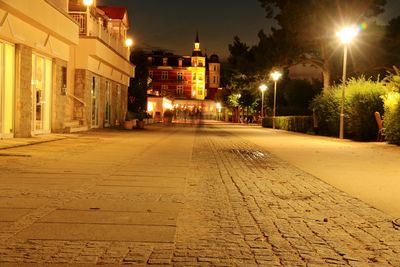View of illuminated street at night
