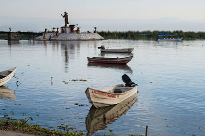 Boat moored in lake