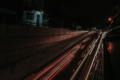 High angle view of light trails on road at night