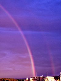 Scenic view of rainbow over landscape