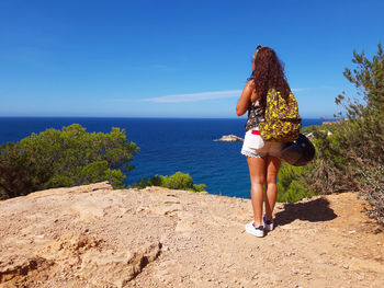 Tourist girl on vacation in the mediterranean sea in ibiza in front of es vedra  in cala d'hort