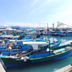 Boats moored at harbor