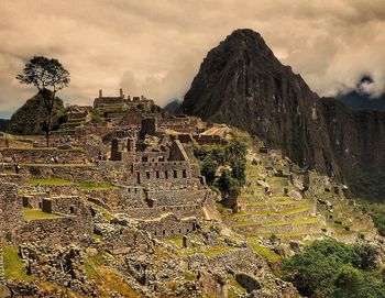 View of old ruins against cloudy sky